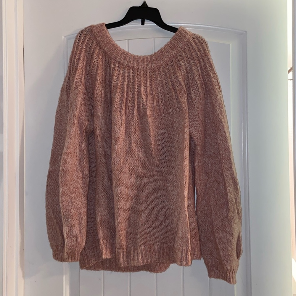 Super soft sweater with beautiful bow detail on the back!